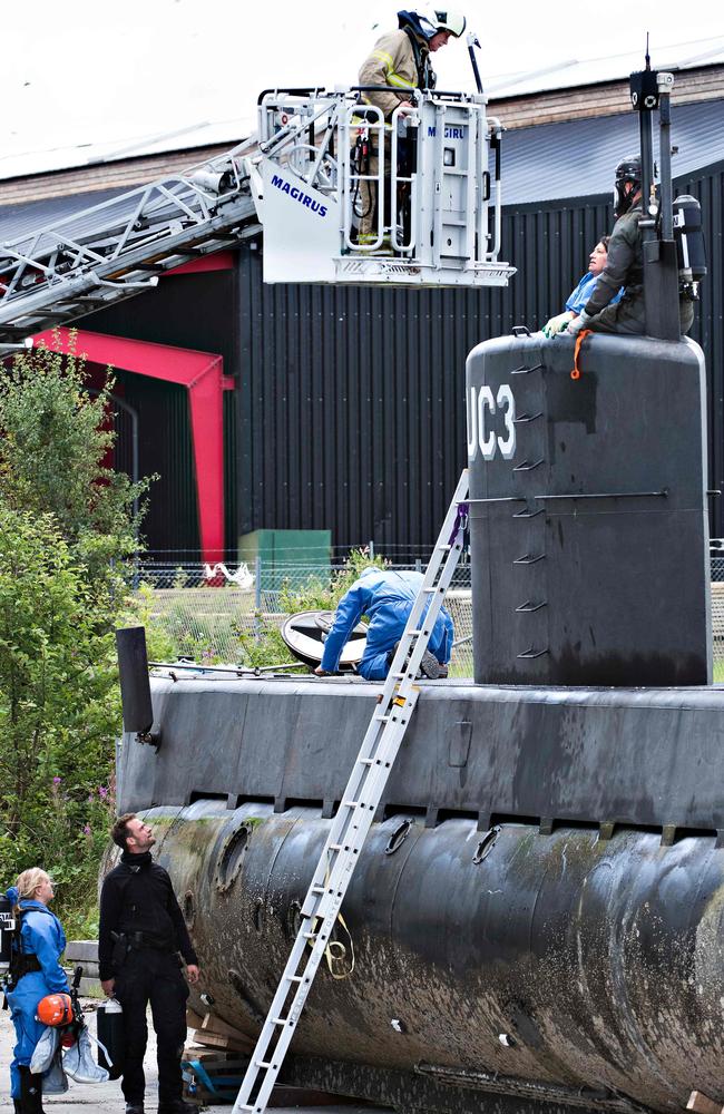 Police technicians prepare to enter the Nautilus after it was salvaged at the weekend. Picture: AFP PHOTO / Scanpix Denmark and Scanpix / Jens Noergaard Larsen