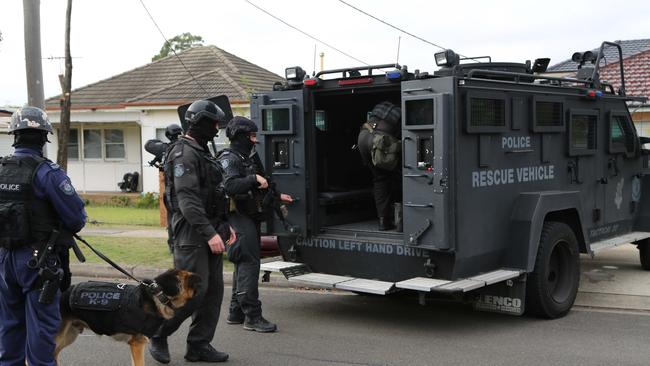 Tactical Operations Unit officers, local police and other specialist units attended two homes just after 6am and conducted extensive searches under the power of firearms prohibitions orders previously served on a number of men who reside at the premises. Picture: NSW Police Media