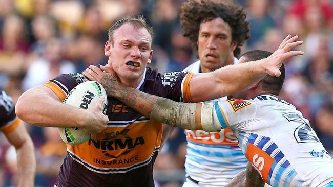 BRISBANE, AUSTRALIA - JUNE 09: Matthew Lodge of the Broncos is tackled during the round 13 NRL match between the Brisbane Broncos and the Gold Coast Titans at Suncorp Stadium on June 09, 2019 in Brisbane, Australia. (Photo by Jono Searle/Getty Images)