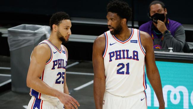 (FILES) In this file photo taken on February 12, 2021 Ben Simmons #25 and Joel Embiid #21 of the Philadelphia 76ers talk during the NBA game at Phoenix Suns Arena on February 13, 2021 in Phoenix, Arizona. – Philadelphia 76ers star Joel Embiid on September 1, 2021 denied reports of a rift with teammate Ben Simmons amid reports that the Australian star is seeking to leave the franchise. (Photo by Christian Petersen / GETTY IMAGES NORTH AMERICA / AFP)