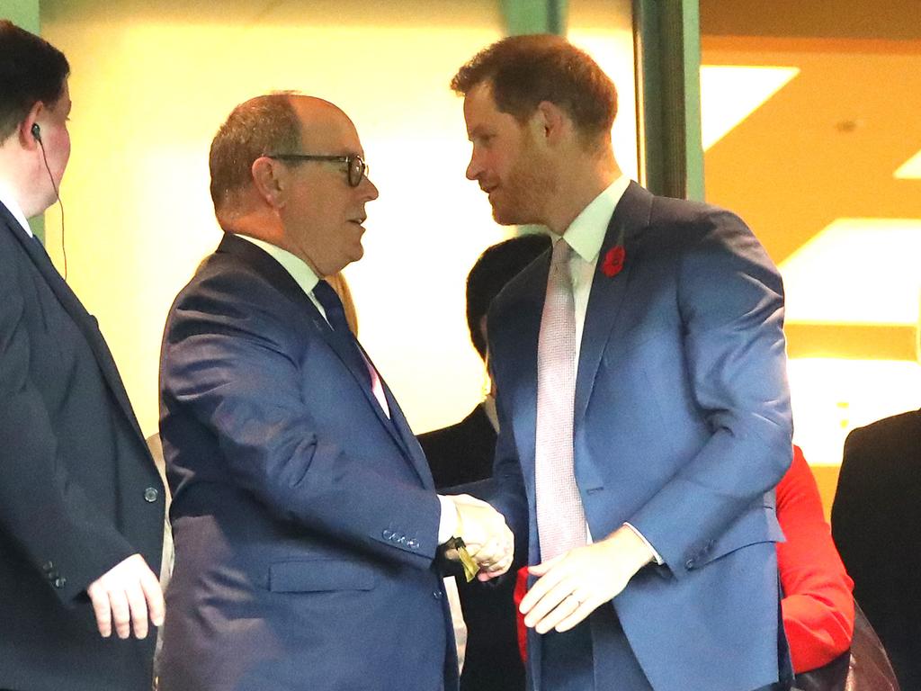 Prince Harry, Duke of Sussex shakes hands with Albert II, Prince of Monaco in the stands during the Rugby World Cup 2019 Final. Picture: Getty