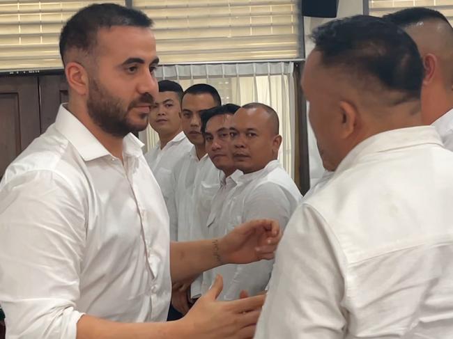 NETWORK SPECIAL. NO AUS, NO NEWS.COM , PLEASE CONTACT NETWORK PICTURE DESK BEFORE PUBLISHING.     , Australian Mohamed Rifai shakes hands with the security guards .   An Australian man who faces up to five years’ prison following an alleged brawl at a posh beach club in Bali will give his testimony in court today after claiming he was hit by 10 security guards at the venue. Mohamed Rifai is accused of hitting security guard Made Bagus Yohanandita, who was detaining his friend, John Ebid, in the incident which occurred in February this year.