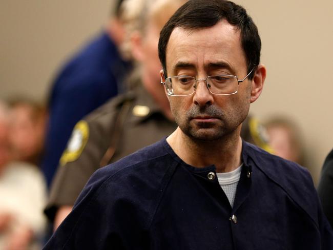 (FILES) This file photo taken on January 24, 2018 shows former Michigan State University and USA Gymnastics doctor Larry Nassar addressing the court during the sentencing phase in Ingham County Circuit Court in Lansing, Michigan.   The US Department of Education announced on February 26, 2018 it was opening an investigation into Michigan State University's handling of reports of sexual abuse by disgraced former school doctor Larry Nassar. Nassar, 54, who was the doctor for the US women's gymnastics team in addition to MSU, is facing life behind bars after pleading guilty to sexually assaulting women and girls under the guise of medical treatment. / AFP PHOTO / JEFF KOWALSKY