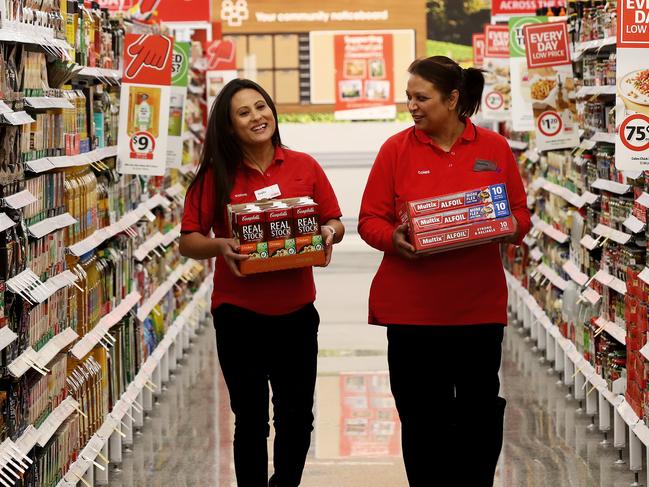 Coles supermarket is opening a new store at Ed.Square in Edmondson Park in Sydney's south west. Employees Anjita Bista Basnet (L) and Sanchita Datta (R) stock the shelves ready for opening. Picture: Toby Zerna