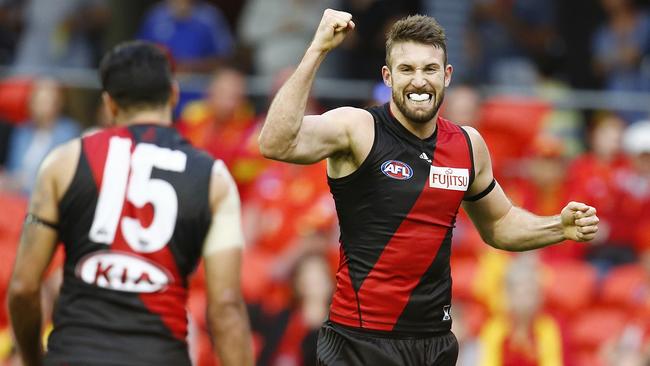 AFL Round 21. Gold Coast Suns vs Essendon at Metricon Stadium, Gold Coast. Cale Hooker celebrates a 1st qtr goal after recieving a handball from Courtenay Dempsey . Pic: Michael Klein