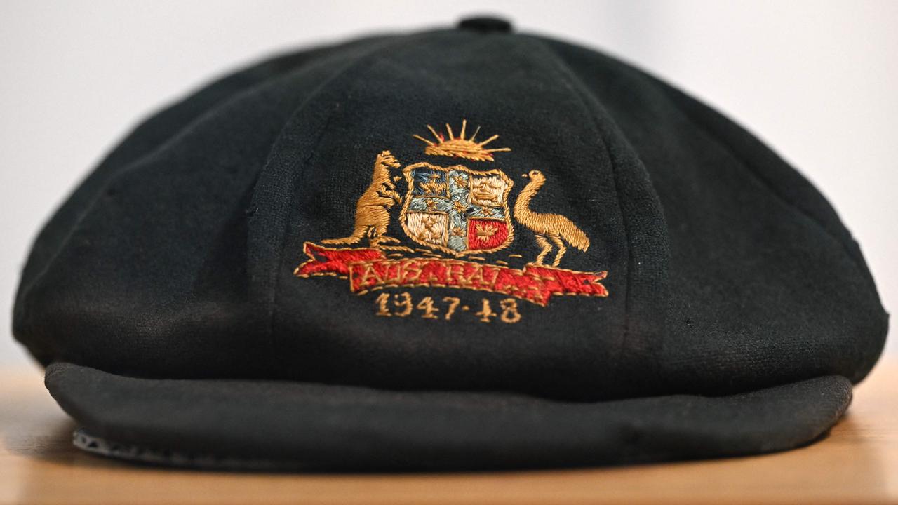 Australian cricket legend Sir Donald Bradman’s “baggy green” was recently sold at auction – but did Pat Cummins dream of wearing his own one day when he was a kid? Picture: Saeed Khan/AFP