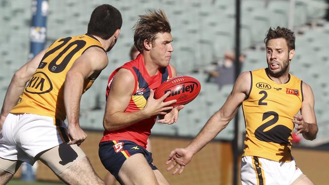 SANFL - STATE GAME - SA v WA at the Adelaide Oval. Sam Colquhoun under pressure from Blaine Johnson and Shane Nelson. Picture SARAH REED