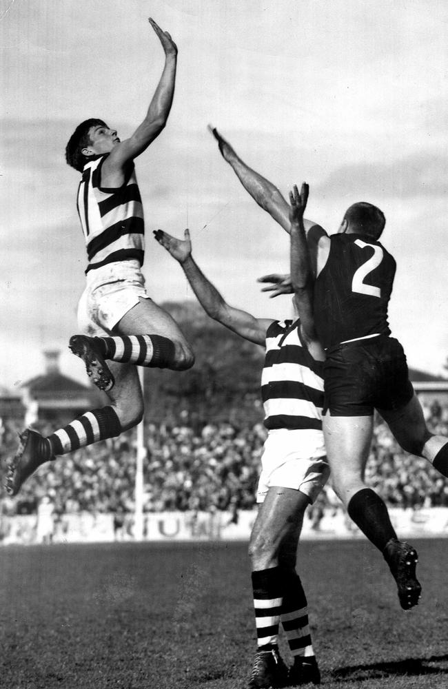 Sam Newman and Graham Farmer battle in the ruck against John Nicholls.