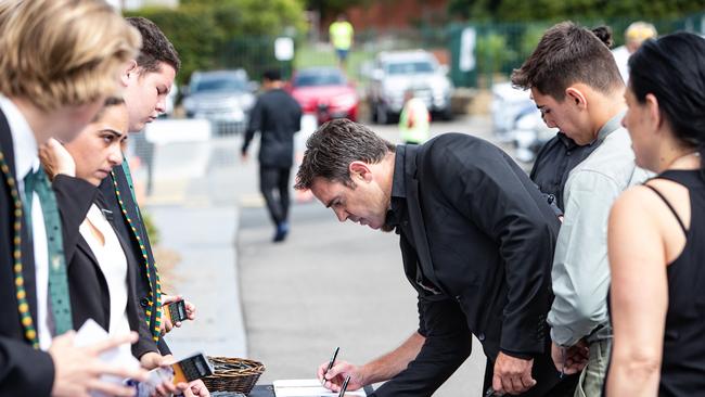 Former player rugby league Brad Fittler signs the book of condolences. (AAP Image / Julian Andrews).