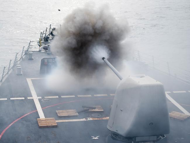 This US Navy photo obtained July 27, 2016 shows the Arleigh Burke-class guided-missile destroyer USS Stethem (DDG 63)as it conducts a firing exercise of the MK 45/5-inch lightweight gun at a surface target during Cooperation Afloat Readiness and Training (CARAT) Singapore on July 26, 2016 in the South China Sea.  CARAT is a series of annual maritime exercises between the US Navy, US Marine Corps and the armed forces of nine partner nations to include Bangladesh, Brunei, Cambodia, Indonesia, Malaysia, the Philippines, Singapore, Thailand, and Timor-Leste.  / AFP PHOTO / Navy Media Content Operations (N / MC1 John PEARL / RESTRICTED TO EDITORIAL USE - MANDATORY CREDIT "AFP PHOTO / US NAVY/MC1 JOHN PEARL" - NO MARKETING NO ADVERTISING CAMPAIGNS - DISTRIBUTED AS A SERVICE TO CLIENTS