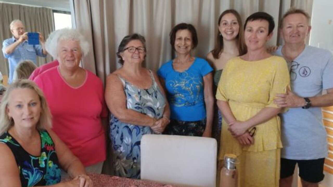 Angie Nichol surrounded by friends at her unit in Coolum Beach.