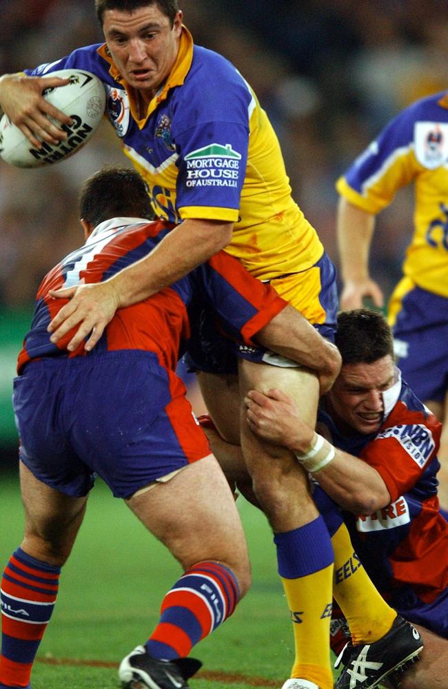 Nathan Hindmarsh is tackled by the strong Newcastle defence in the 2001 NRL grand final. Picture: AAP Image/Dean Lewins