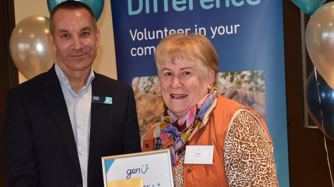 Senior genU executive Travis Heeney has left the organisation abruptly. He is pictured here presenting Lynne Hill with her award for 15 years volunteering service last month. Picture: Supplied.