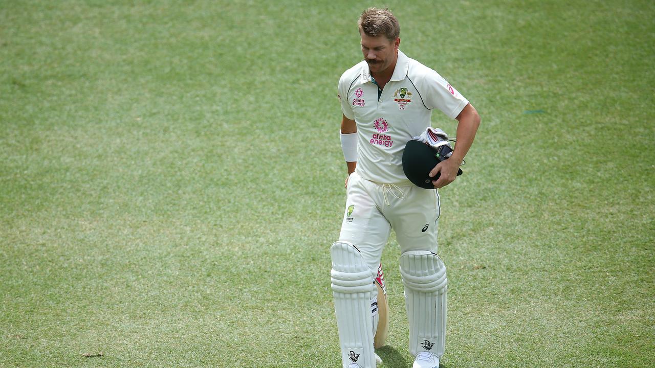 David Warner of Australia walks off the field after been dismissed by Mohammed Siraj.