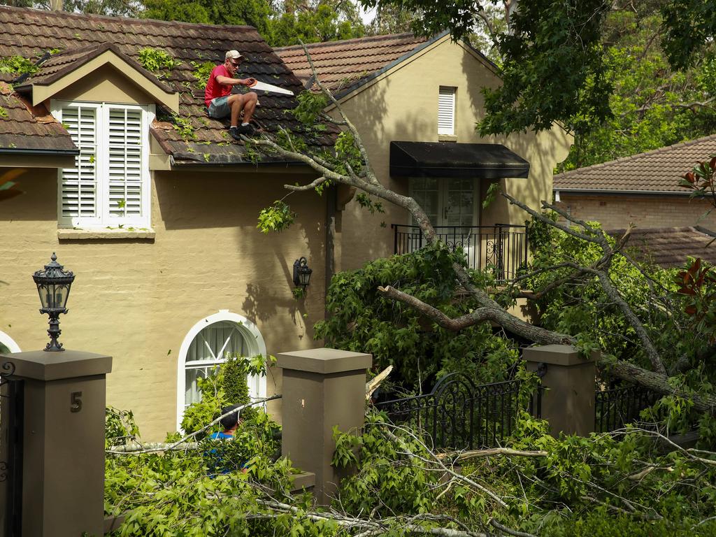 The clean up operation in Church Street, Pymble, after a storm hit some of the northern suburbs of Sydney. Picture: Justin Lloyd