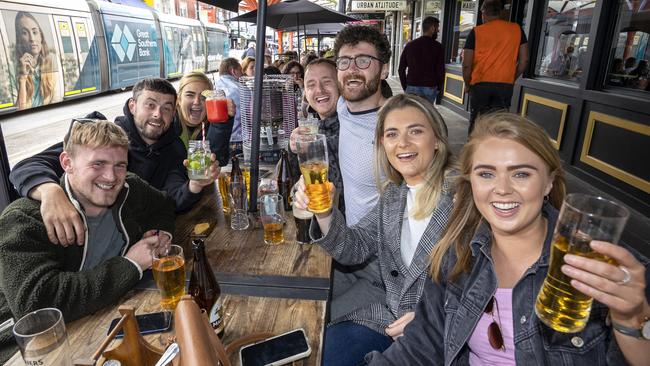 A group enjoys a St Kilda Sunday session as double vaxxed Melburnians return to pubs and restaurants. Picture: David Geraghty