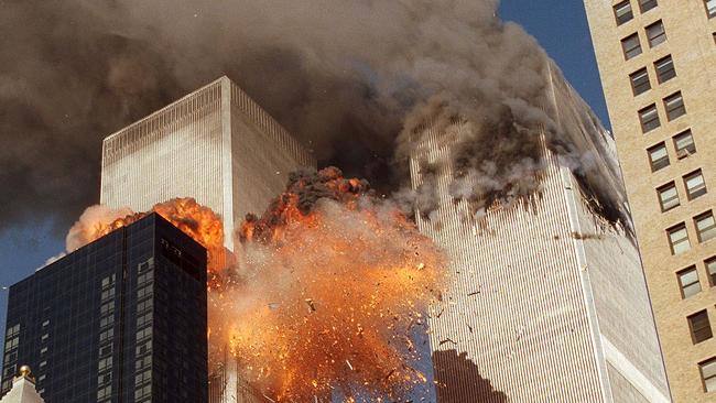 Smoke billows from one of the towers of the World Trade Center and flames and debris explode from the second tower on 9/11. Picture: AP