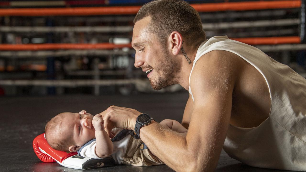 Toowoomba boxer Steve Spark with his 9 week old son Hudson Spark. Thursday, November 11, 2021. Picture: Nev Madsen.