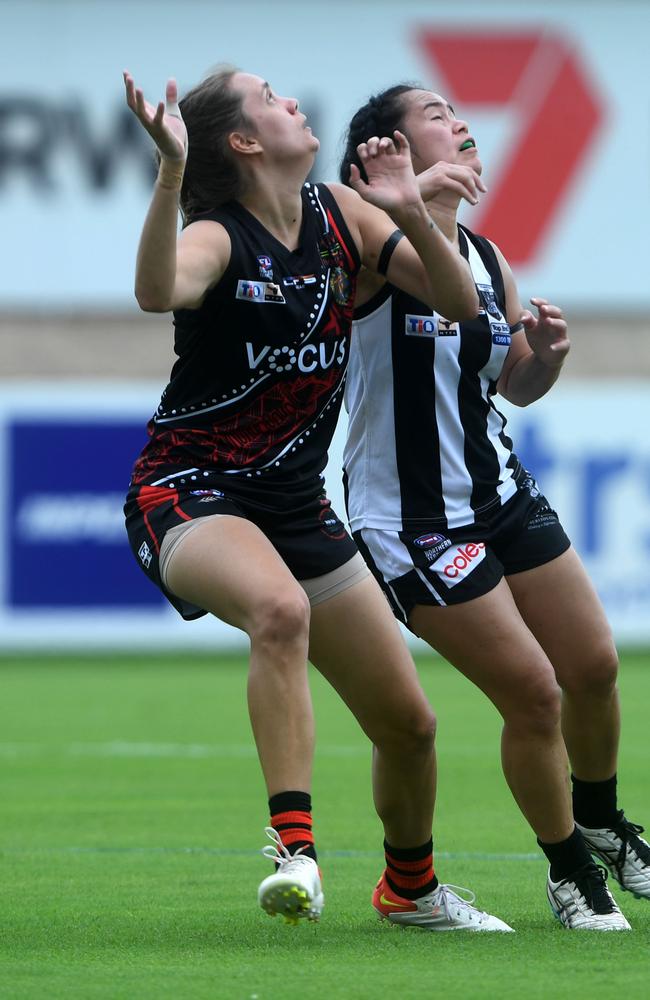 Kirra Hill-Carter pushes off Missy Munro in round one of the NTFL 22/23 season. Picture: (A)manda Parkinson