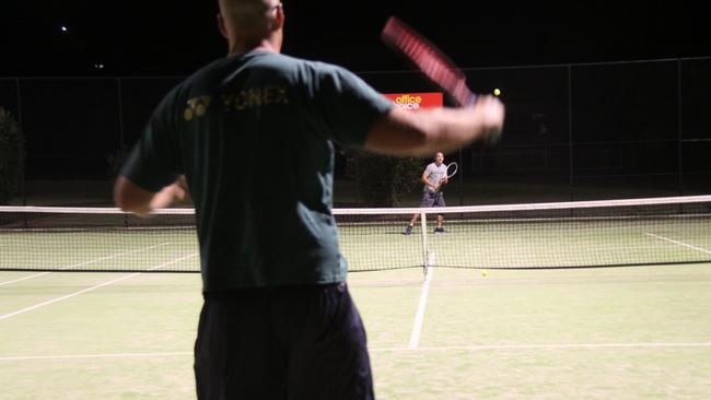 LOVE-ALL: East Lismore Tennis Club president Michael Oaten (facing) said members are able to play single matches using quarantine processes approved by Tennis NSW during the pandemic to keep fit and positive. Photo: Alison Paterson.