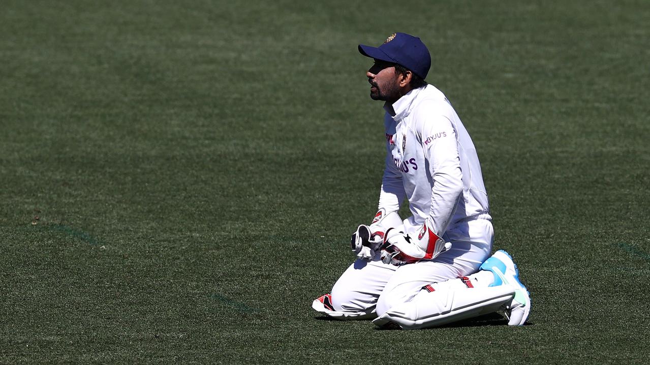 India on its knees: Wriddhiman Saha reacts after dropping a shot by Marnus Labuschagne during the First Test. (Photo by Ryan Pierse/Getty Images)