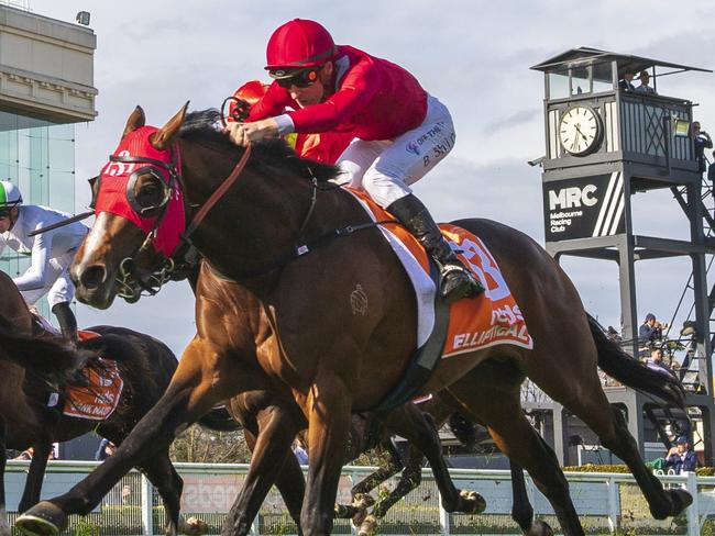 MELBOURNE, AUSTRALIA - OCTOBER 08: James McDonald riding Golden Mile (ctr) defaets Elliptical and Osipenko (L) in Race 8, the Neds Caulfield Guineas,  during Caulfield Guineas Day at Caulfield Racecourse on October 08, 2022 in Melbourne, Australia. (Photo by Vince Caligiuri/Getty Images)