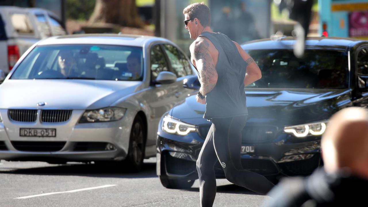 Ben Roberts-Smith jogs along Elizabeth Street in Sydney earlier this month after Covid-19 put his defamation trial on hold. Picture: Toby Zerna