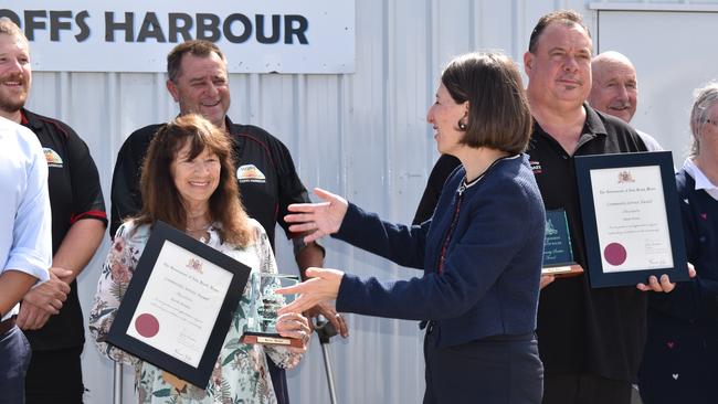 NSW Premier Gladys Berejiklian presented locals Dean Evers (right) and Aunty Kerrie Burnet with Community Service Awards in Coffs Harbour on October 26.