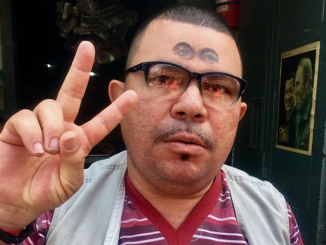 A Hugo Chavez fan with the former leader’s eyes tattooed on his head. Picture: Courtesy of the ABC