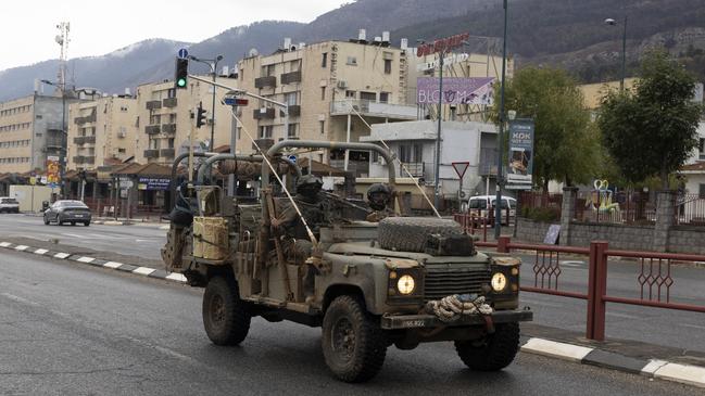 An Israeli army vehicle moves in the city following a ceasefire agreement on November 27. Picture: Amir Levy/Getty Images