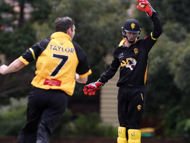 Monash Tigers wicketkeeper Scott Edwards completes a run out. 