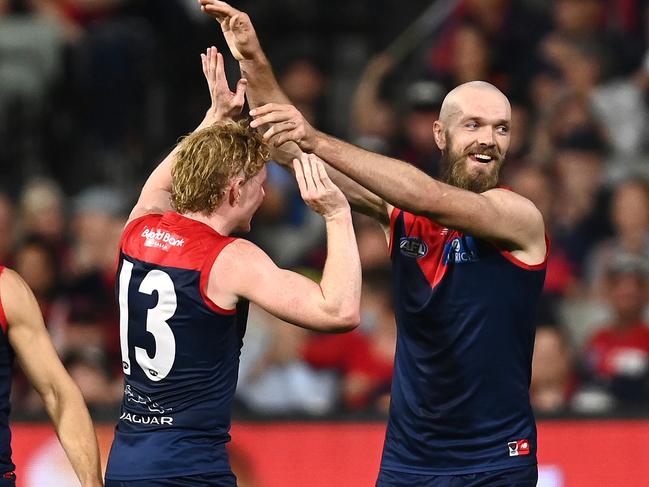 MELBOURNE, AUSTRALIA – APRIL 16: Max Gawn of the Demons is congratulated by Clayton Oliver after kicking a goal during the round five AFL match between the Melbourne Demons and the Greater Western Sydney Giants at Melbourne Cricket Ground on April 16, 2022 in Melbourne, Australia. (Photo by Quinn Rooney/Getty Images)