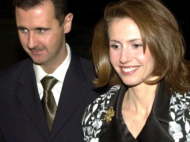 (FILES) Syrian ousted president Bashar al-Assad and his wife Asma arrive for a dinner hosted by Britain's Lord Chancellor, Lord Irvine of Lairg, at Lancaster house in central London 16 December 2002. Once seen as an advocate of women's rights in the Middle East, Syria's British-born former first lady Asma al-Assad has fled into exile with her husband, with UK officials saying she is not welcome home. (Photo by NICOLAS ASFOURI / POOL / AFP)