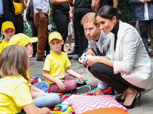 The royals chat with kids at Sydney’s Olympic Park. Picture: Getty