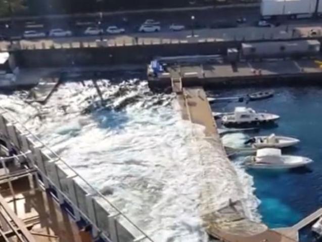 Picture: Break.com 134,000-ton cruise liner floods marina after it causes a mini tsunami.