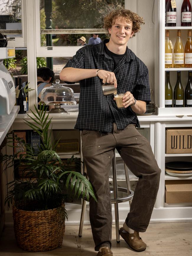 Tom Oswald, serving customers and making coffee in his pop-up business, Homeboy Cafe, in Hahndorf, SA. Picture: Emma Brasier