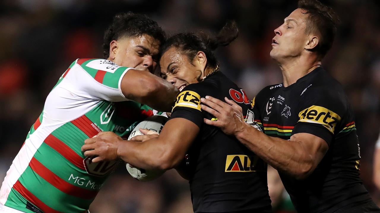 Latrell Mitchell charges into to Jarome Luai and Scott Sorensen. Picture: Matt King/Getty Images