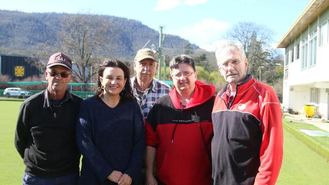 New Norfolk Bowls club volunteer David Briggs, independent senator for Tasmania Jacqui Lambie, Shane Malone, Shane Hugo and Denzil Ransley clean up the bowls club after the flood. Picture: Elise Kaine