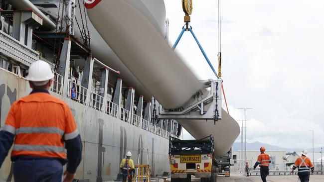 Huge wind turbine blades each 79 metres long are unloaded from the cargo ship Chipol Changjiang at the Port of Cairns, before being transported by road to the Kaban Green Power Hub near Ravenshoe. When completed, the wind farm will feature 28 windmills 226 metres in height, producing a total of 157 megawatts of power output. Picture: Brendan Radke