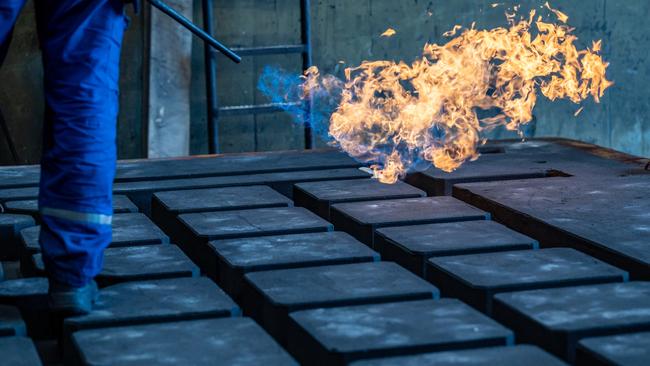 A worker uses a gas burner to prepare a casting mould for iron casting at a foundry in Krefeld, Germany. The Siempelkamp foundry is one of many companies in Germany's manufacturing sector that would be acutely affected by a halt of energy imports from Russia, especially natural gas. Picture: Getty Images