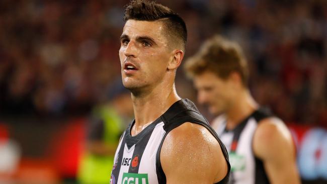 Scott Pendlebury walks off the MCG on Anzac Day.