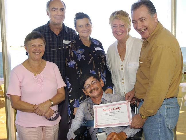 Bourke Gibbons (Seated) with Coralie Kellahan, Rolf Wood, Marion Wood, Rhonda Gibbons and his brother Scott Gibbons at the presentation of a Manly Daily Centenary Award. Picture: Manly Daily..