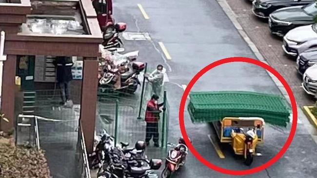 Green fences are being constructed around buildings in Shanghai.