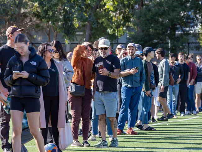 Victorians line up at North Brunswick Primary School to cast their vote. Picture: Brendan Beckett