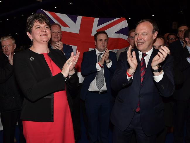 BELFAST, NORTHERN IRELAND - JUNE 09: DUP leader Arlene Foster celebrates with DUP deputy leader Nigel Dodds at the Belfast count centre on June 9, 2017 in Belfast, Northern Ireland. After a snap election was called, the United Kingdom went to the polls yesterday following a closely fought election campaign. The results from across the country are being counted and an overall result is expected in the early hours. (Photo by Charles McQuillan/Getty Images)