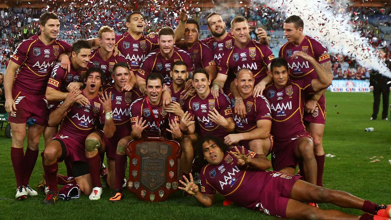 Queensland players pose for a team photo and celebrate winning game three of 2013.