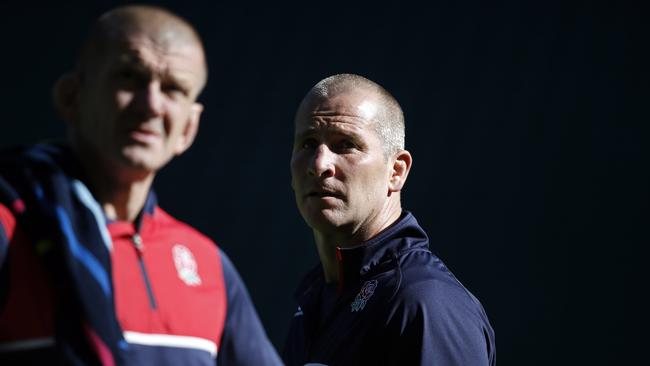 England's head coach Stuart Lancaster (C) and forwards coach Graham Rowntree look on during the Captain's Run training session at Twickenham Stadium, south west London on September 25, 2015. England play Wales tomorrow in their second Rugby World Cup Pool A match. AFP PHOTO / ADRIAN DENNIS RESTRICTED TO EDITORIAL USE