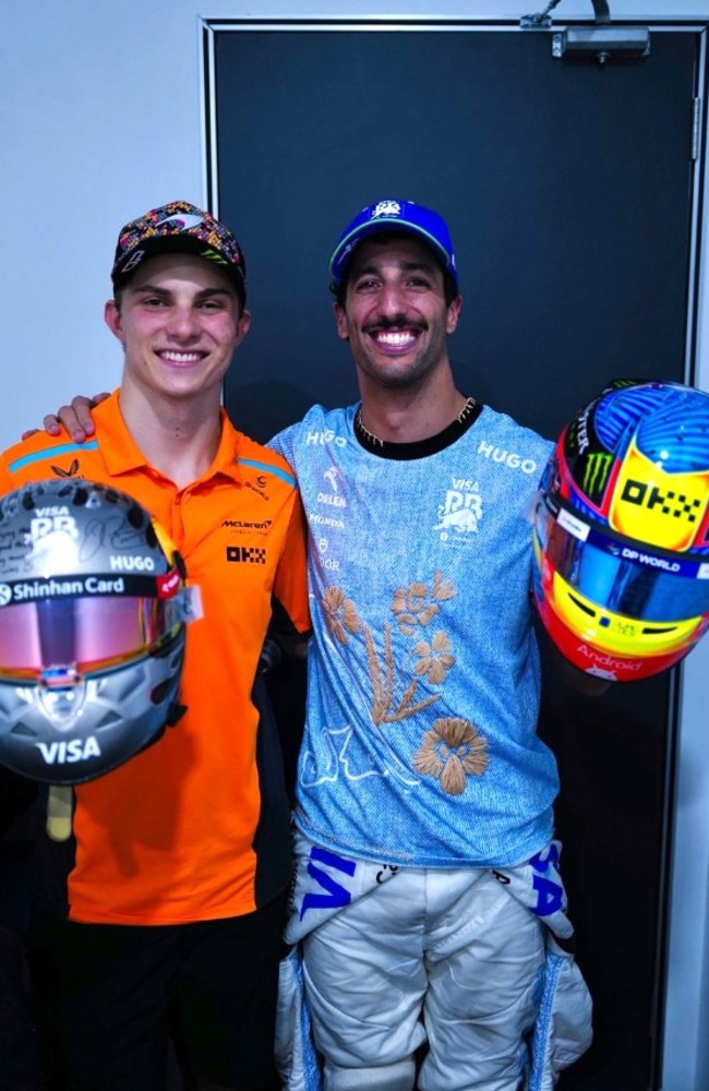 Daniel Ricciardo and Oscar Piastri swap helmets. Photo: Instagram, @danielricciardo.