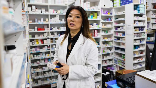 Pharmacist Angela Song, in Sydney’s inner southwest, says she is longing to vaccinate her multicultural customers but the authorities won’t let her. Picture: Ryan Osland