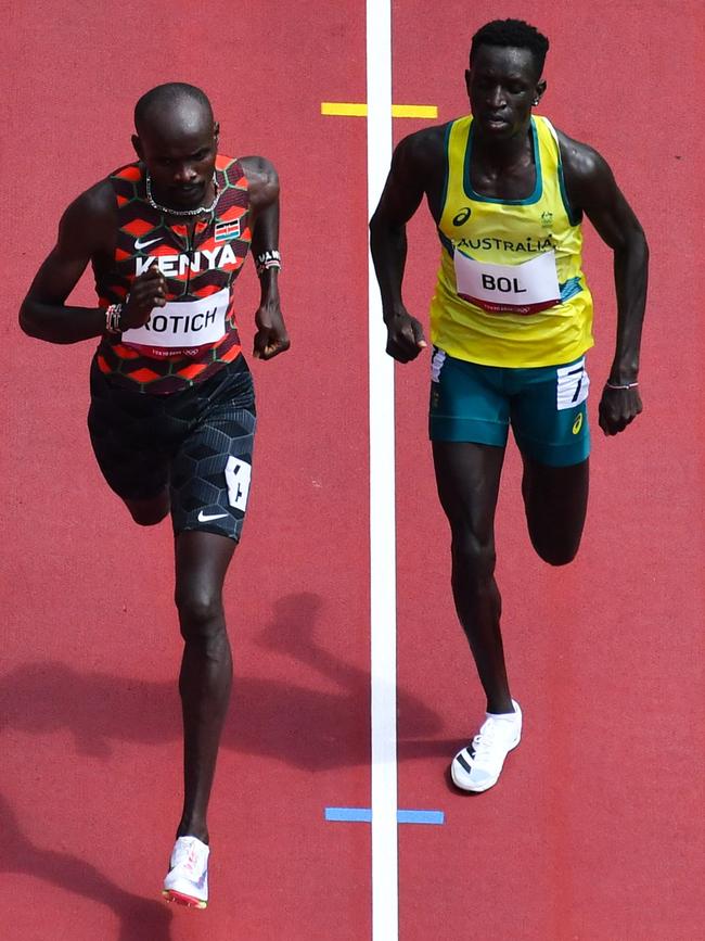 Kenya’s Ferguson Cheruiyot Rotich (left) and Australia’s Peter Bol go across the line 1-2 in their men’s 800m heat. Picture: AFP